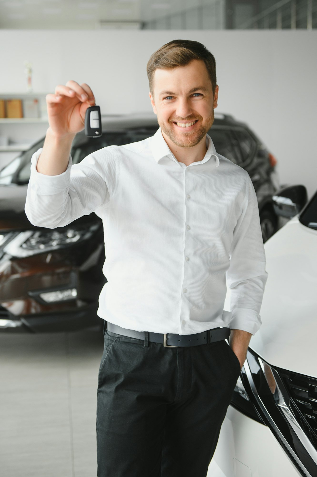 Man buying a car at a showroom